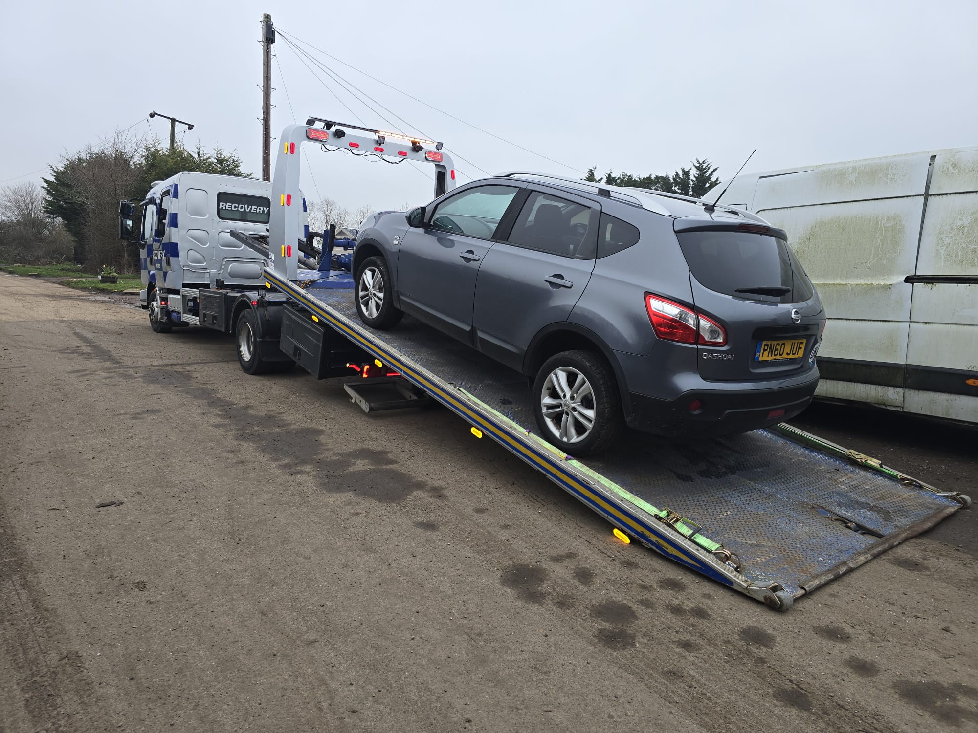Vehicle repair workshop with cars on ramps